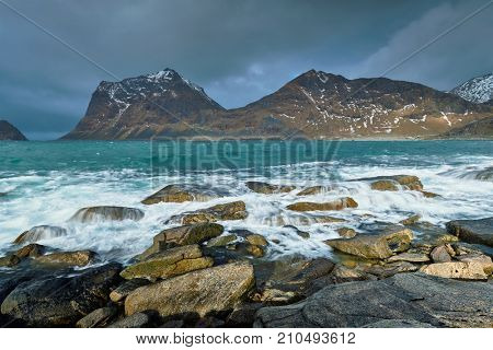 Rocky coast of fjord of Norwegian sea in winter. Lofoten islands, Norway