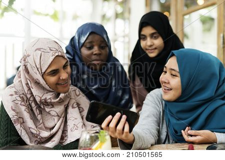 Group of students using mobile phone