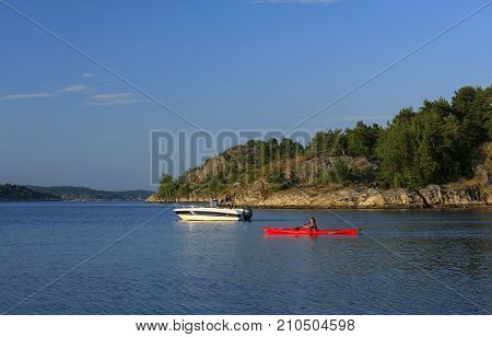 KRISTIANSAND ARCHIPELAGO, NORWAY ON JULY 01. View from the shore of boating people on the North Sea on July 01, 2009 in Kristiansand archipelago. Unidentified people. Editorial use.