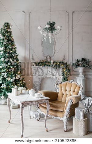 Christmas room with decorated wooden table. Christmas morning in a luxurious house
