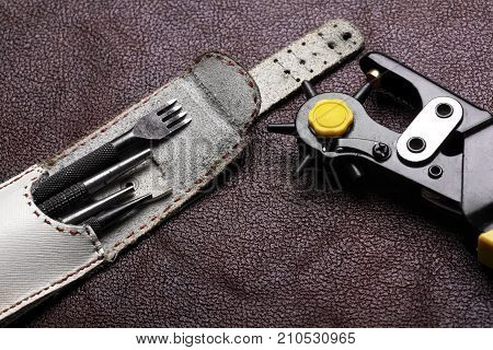 Leather Craft Tools On A Bordo Leather Background
