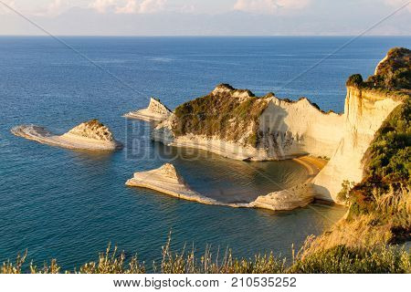 Cape Drastis In Corfu, Greece, Bathed In Afternoon Light