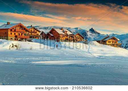 Stunning winter sunset landscape and ski resort in French Alps, Alpe D Huez, France, Europe