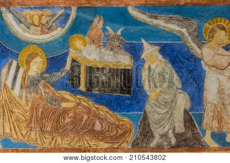 The birth in the stable Christmas freco in a medieval church. Bjaresjo Sweden September 4 2014