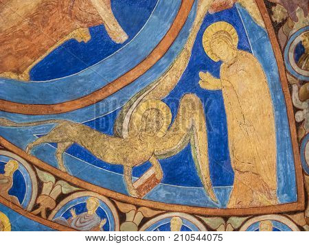 John the Baptist and an ox in a medieval fresco Bjaresjo church Sweden November 6 2009