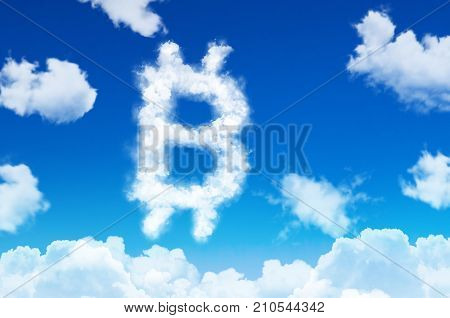 Bitcoin Symbol In The Form Of Clouds Of Steam Against A Blue Sky With Clouds.