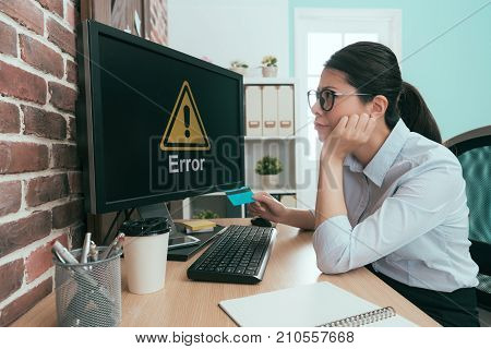 Beautiful Young Office Worker Holding Credit Card