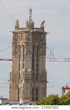 The tower Saint Jacques - Paris, France. The tower Saint Jacques is an isolated tower, built between 1509 and 1523, raised (drawn up) in the middle of the first Parisian public garden, which bears its name, in 4 District of Paris.