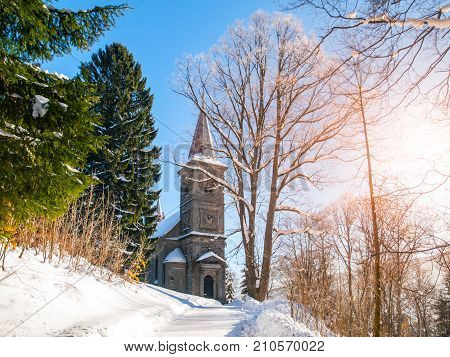 Stone church of Saint Peter and Paul in Tanvald on sunny winter day, Czech Republic.