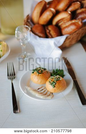 Ukarnian food - round pastries pampushki on ceramic plate