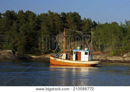 KRISTIANSAND ARCHIPELAGO, NORWAY ON JULY 01. View from the shore of boating people on the North Sea on July 01, 2009 in Kristiansand archipelago. Unidentified people. Editorial use.