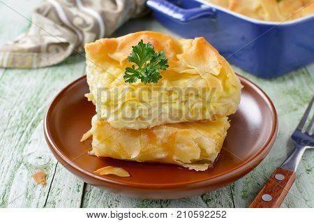Cheese puff pie from unleavened dough. Georgian cuisine - khachapuri Achma