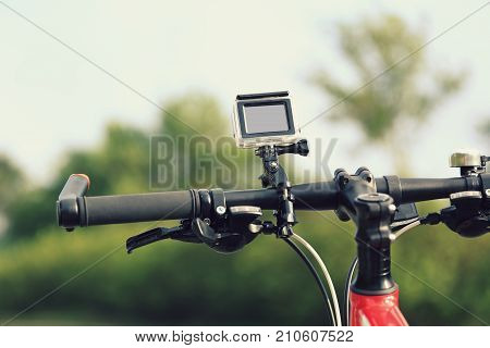 closeup of action camera mounted on mountain bike