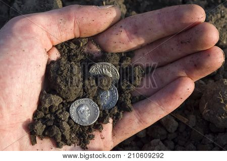 Hand Holding Roman Denarius (roman Silver Coin)