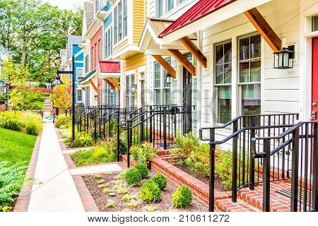 Row Of Colorful, Red, Yellow, Blue, White, Green Painted Residential Townhouses, Homes, Houses With