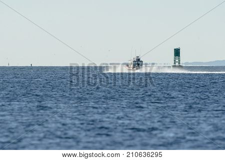 Fairhaven Massachusetts USA - October 20 2017: Fairhaven Fire Department patrol boat heading toward Buzzards Bay