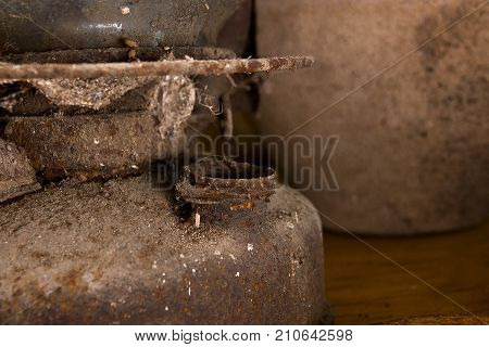Old rusty kerosene lamp on the kitchen table
