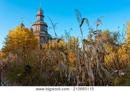 Old wooden church, standing in the autumn park Ukraine