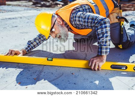 Construction Worker Using Spirit Level