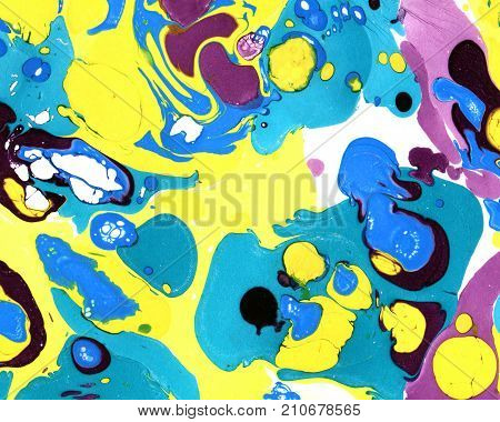 Abstract marbling ebru colorful background with yellow, purple, green blots and splashes, handmade illustration. Beautiful brightly colored handmade background with marbling, ebru effect