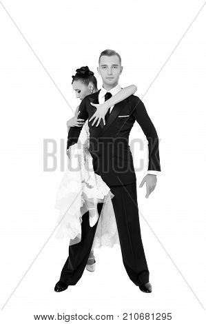 dance ballroom couple in a dance pose isolated on white background. sensual professional dancers dancing walz tango slowfox and quickstep. black and white couple in love romantic concept