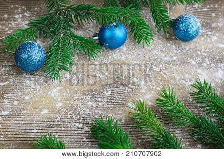 Xmas Tree Branches, Blue Balls On Winter Snowed Wooden Background