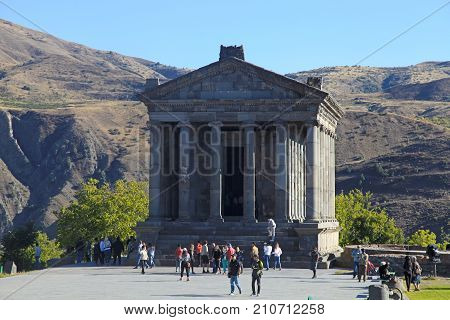 GARNI, ARMENIA - OCTOBER 1, 2016: Tourists at Ancient hellenistic Garni pagan Temple in Armenia