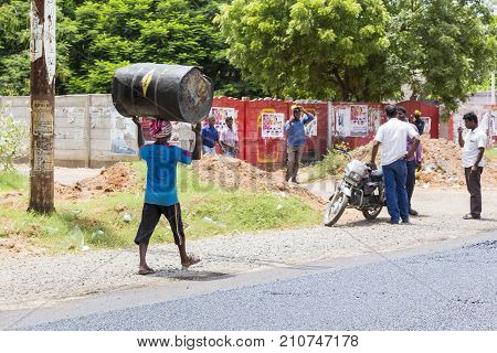 PONDICHERY PUDUCHERY INDIA - SEPTEMBER 05 2017. Unidentified workers works on a road construction industry and teamwork