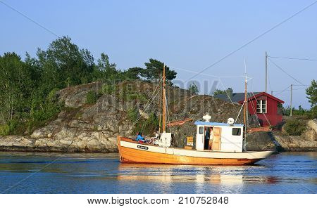 KRISTIANSAND ARCHIPELAGO, NORWAY ON JULY 01. View from the shore of boating people on the North Sea on July 01, 2009 in Kristiansand archipelago. Unidentified people. Editorial use.