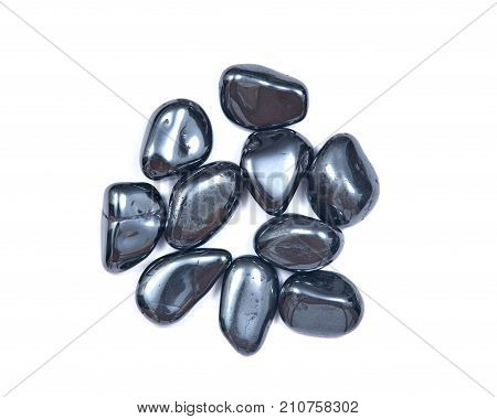 Bright and shiny metallic gray tumbled hematite isolated on white background