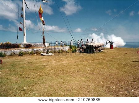 NUKU'ALOFA, TONGATAPU / TONGA - CIRCA 1990: Tongan soldiers fire cannons towards the Pacific Ocean, during a national holiday.