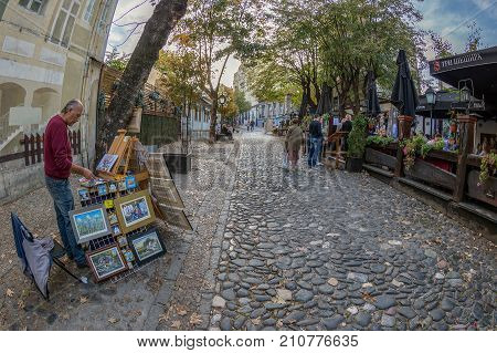 BELGRADE SERBIA - OCTOBER 21 2017: Painter and restaurant on the old street Skadarlija the main bohemian place of Belgrade.