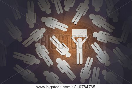 Paper people in disjointed form lie on a wooden surface. A man with an idea a leader an original.