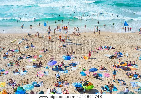 People At Ocean Beach. Portugal