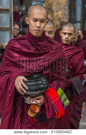 AMARAPURA MYANMAR - SEP 03 : Monks at the Mahagandayon Monastery in Amarapura Myanmaron September 03 2017 Mahagandayon Monastery has 2000 monks at any given time.