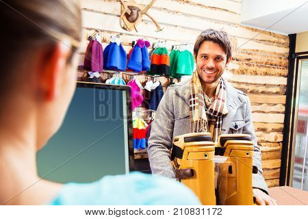 a young man is getting a new pair of ski boots in a skiing store