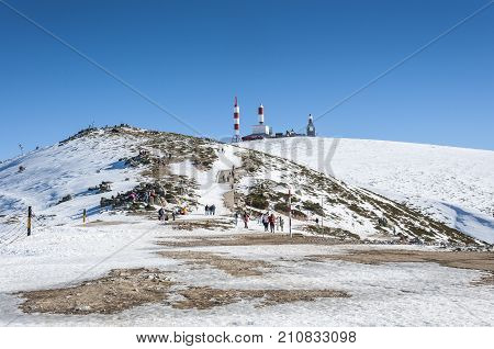 NAVACERRADA - JANUARY 4 2015: Tourists in Navacerrada Ski Resort Navacerrada Mountain Pass Madrid Spain on January 4 2015.