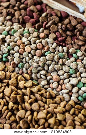 Dry pet food background - three kinds. Meat.