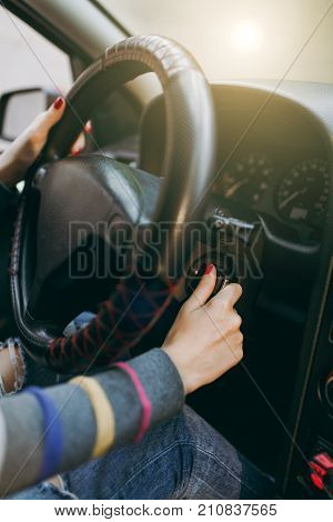 Young European Woman With Healthy Clean Skin Put Her Hands With Red Manicure On Her Nails On The Ste