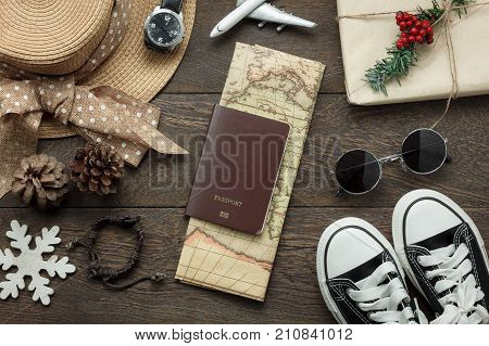 Table top view of ornaments and decorations Merry Christmas and Happy New Year with accessory travel concept background.Essential item on modern rustic home office desk.object prepare for travelling.