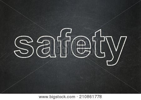 Safety concept: text Safety on Black chalkboard background