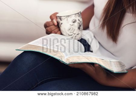 Close Up Of Young Lady Studying Her Bible
