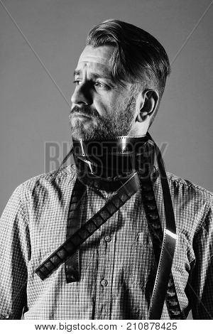 Portrait Of An Attractive Man In A Scarf From An Old Photographic Film