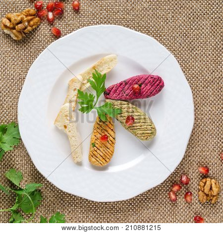 Georgian cuisine. Spinach appetizer phali with pomegranate seeds