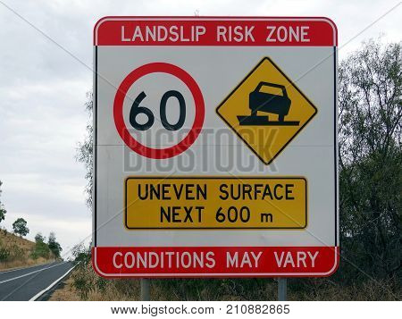 A speed sign warding of  a landslip risk zoned and uneven surface for the next 600m