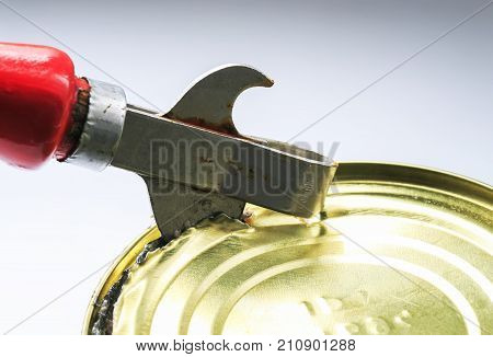 old rusty metal knife opens a metal tin