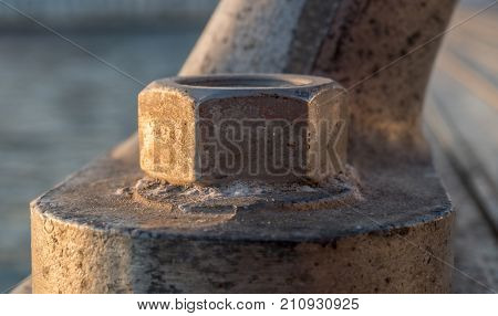 old rustic screw-bolt on a Bollard maritime dock