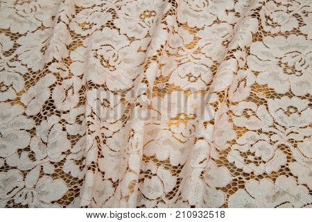 air guipure beige color on a colored background