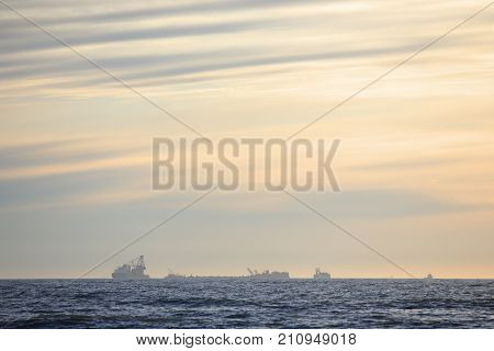 exploratory oil platform under construction offshore in the evening haze