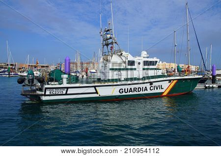 Corralejo, Fuerteventura, Canary Islands, Spain - October 24, 2017: Spanish Guardia Civil nautical Coastal patrol, surveillance and rescue vessel (Rodman 66), in the harbor of Corralejo.